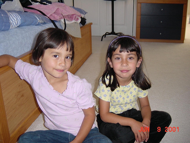 Tara and Sonia watching a cartoon movie.jpg