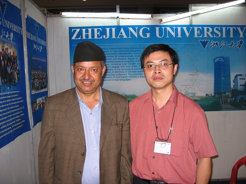07-03-30-215843.JPG - Ramakant Sir's youngest son - Suman - is an undergraduate student at Zhejiang University. Mr. Lu Zhengzhong was representing Zhejiang university at the exhibition. Both Ramakant Sir and Mr. Lu were happy to get to know each other and talk about Suman. Mr. Lu said, Suman was a good student and he even advised Mr. Lu about weather and other conditions in Kathmandu before Mr. Lu left China.
